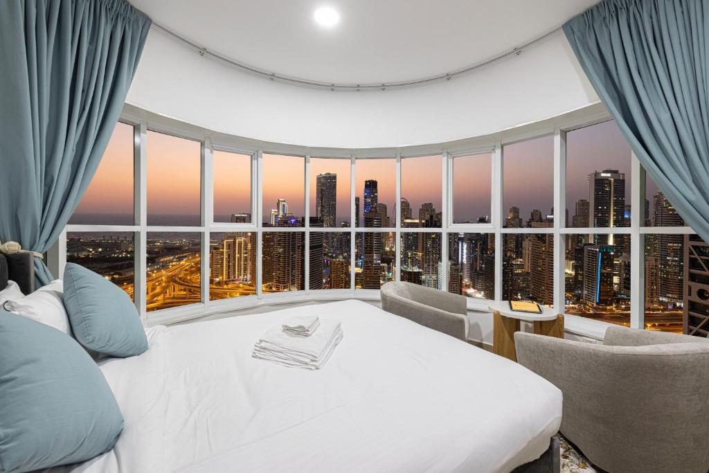 Example of a panoramic hotel room view with wide city skyline windows